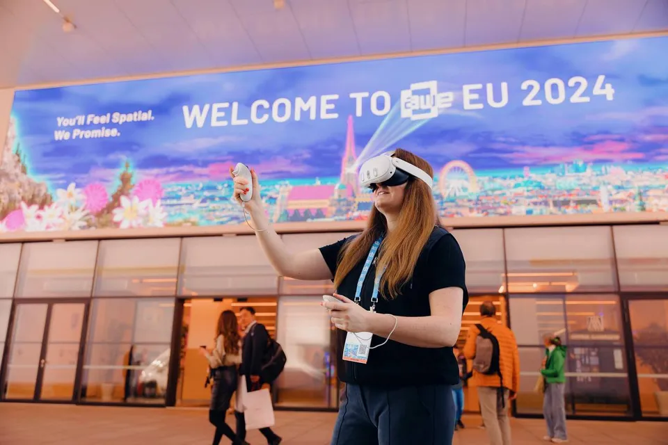 Person using AR devices at tech event, highlighting AR technology and AR experiences.