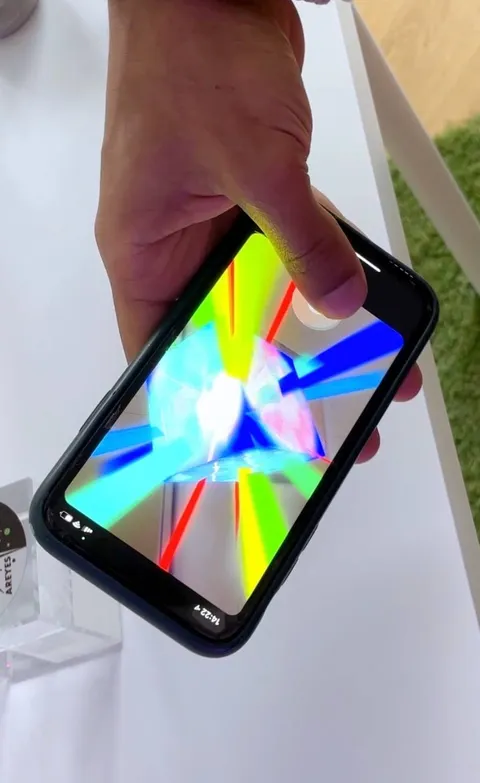 AREYES Studio addresses the challenge of understanding color effects on human perception by utilizing a 3D glass cube and market-based AR mechanics, presenting the Color Positive AR experience that interprets colors through a phygital object, encouraging positive emotional responses and highlighting the impact of colors on daily happiness.